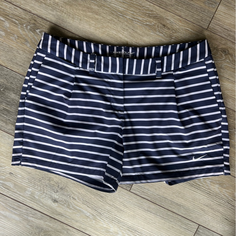 Nike golf shorts, size 8, never worn. Navy and white striped.
